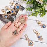 7Pcs 7 Style Evil Eye Resin Pendant Decorations, with Alloy Crystal Rhinestone Findings, Golden, Mixed Patterns, 57~69mm, 1pc/style