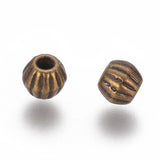 Tibetan Style Spacer Beads, Lead Free & Nickel Free & Cadmium Free, Bicone, Antique Bronze Color, Size: about 4mm long, 4.5mm wide, hole: 1mm., 100pcs/Set